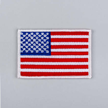 Embroidered American Flag Patch with white border laid flat