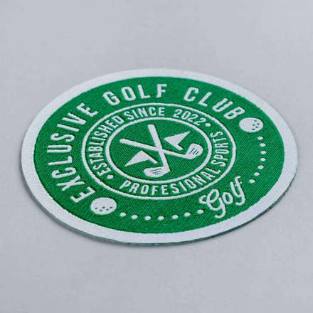 Woven Exclusive Golf Club patch laid at a hard angle
