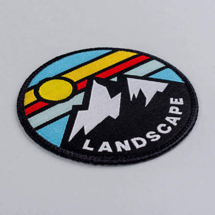 Woven mountain landscape patch laid at a hard angle