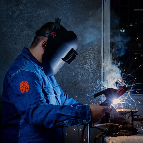 Faux Suede Patch Applied to the Arm of Welder's Uniform