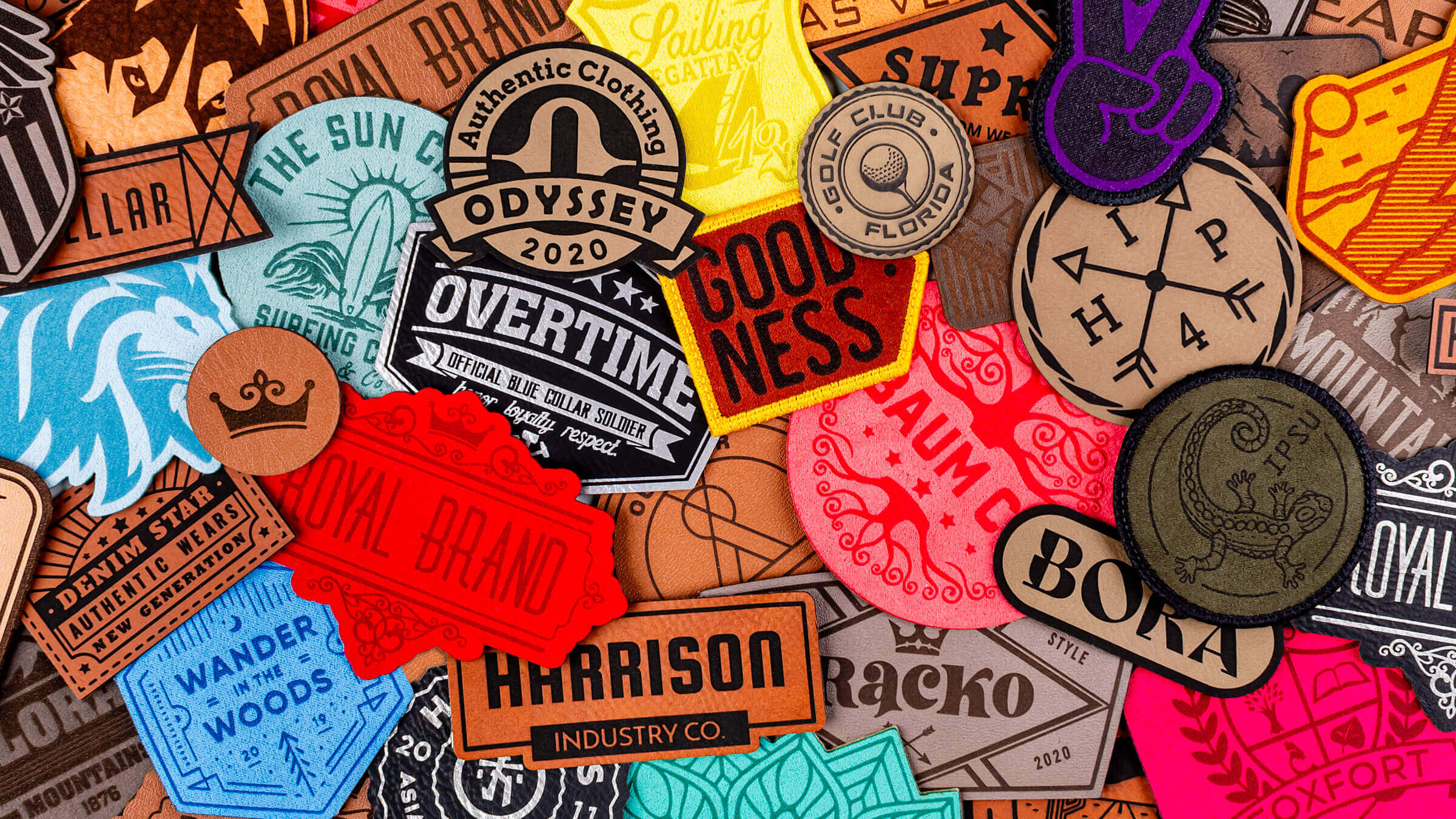 A variety of Leather patches layered flat on top of one another, covering the surface